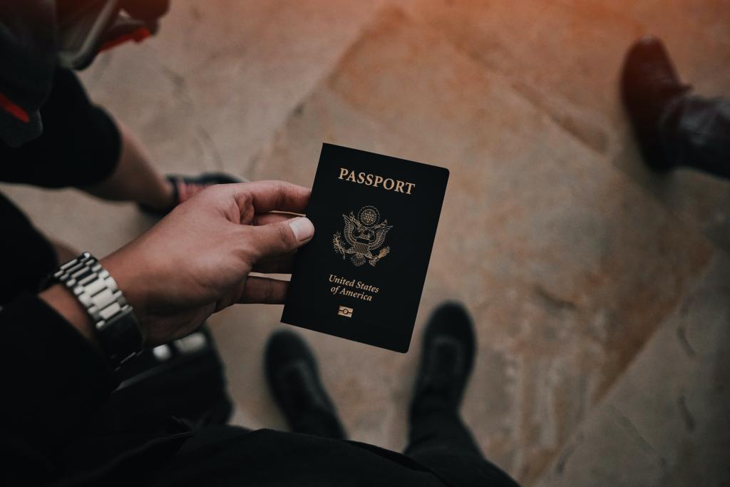 A photo of a United States passport introduces the Bousquet Holstein naturalization practice. 