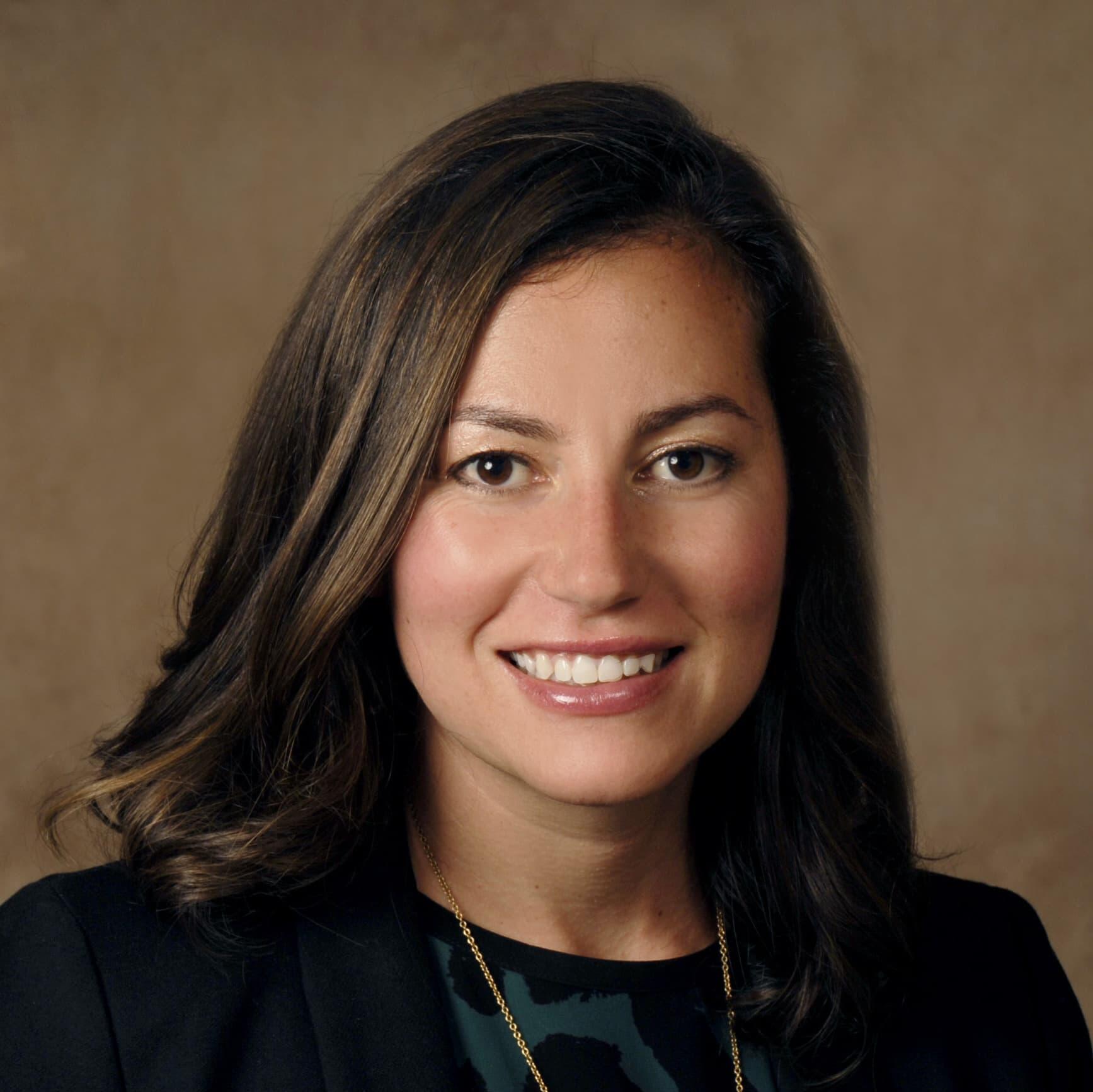 Syracuse Immigration attorney Rebecca Cohen smiles for her studio headshot.